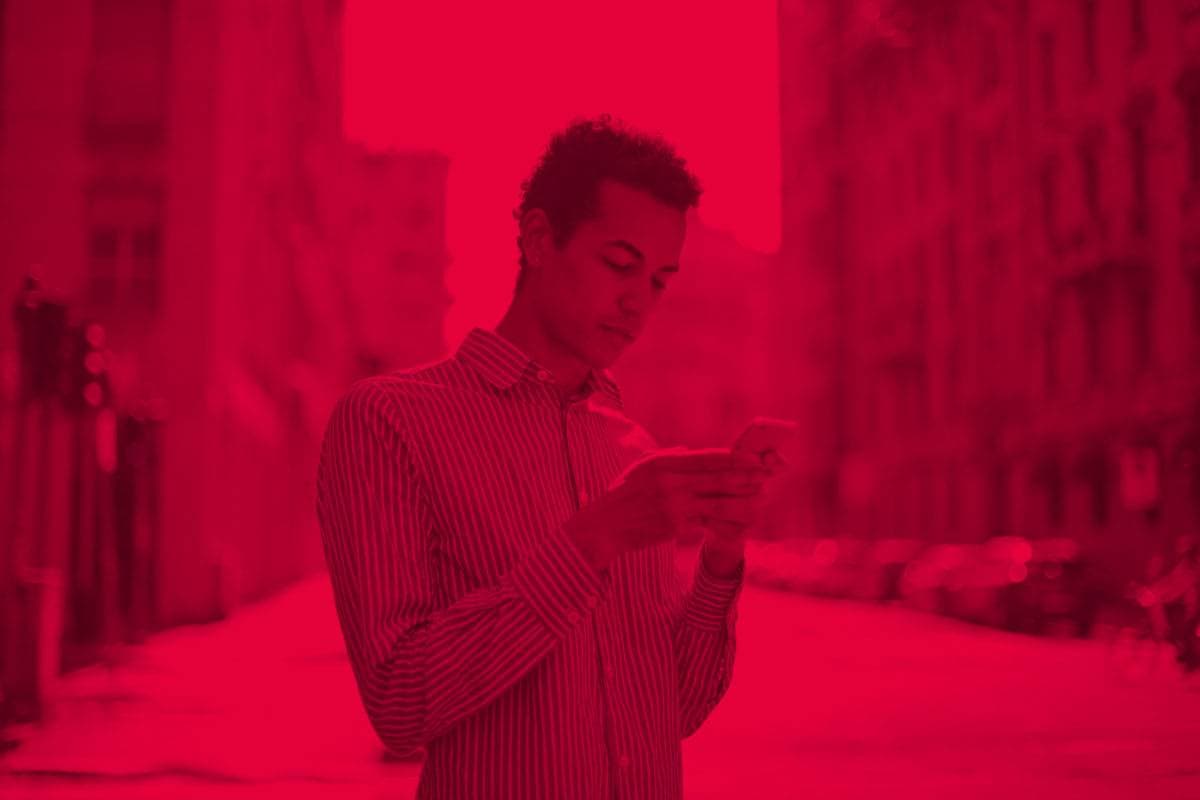 Man on the phone with a red overlay filter