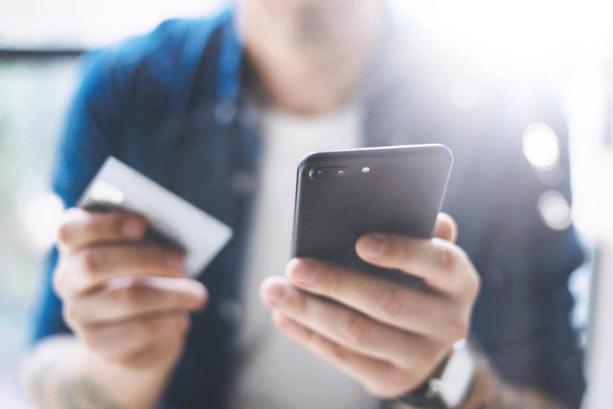 Man with phone and creditcard