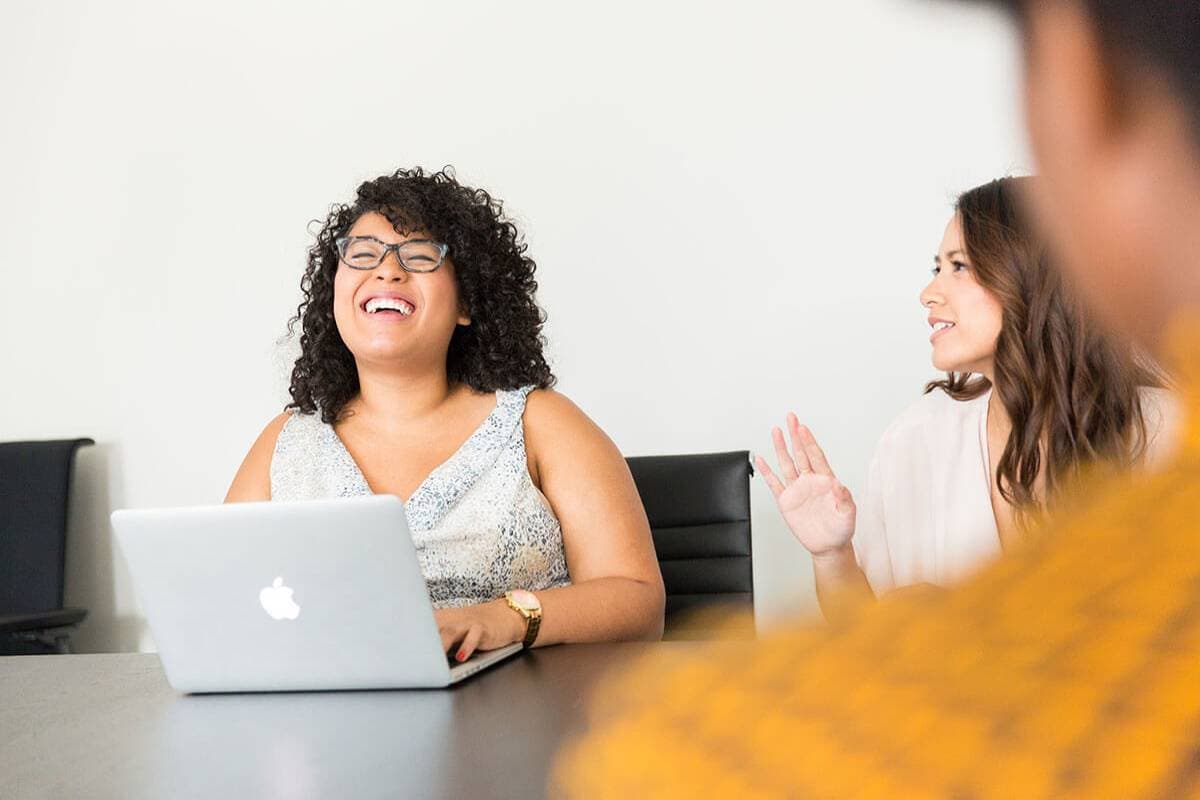 People in office laughing