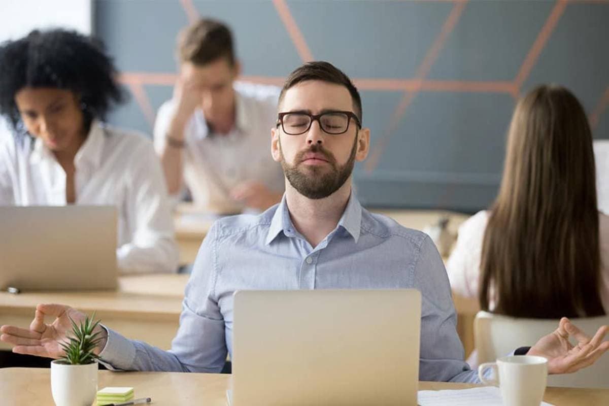 Man meditating at office