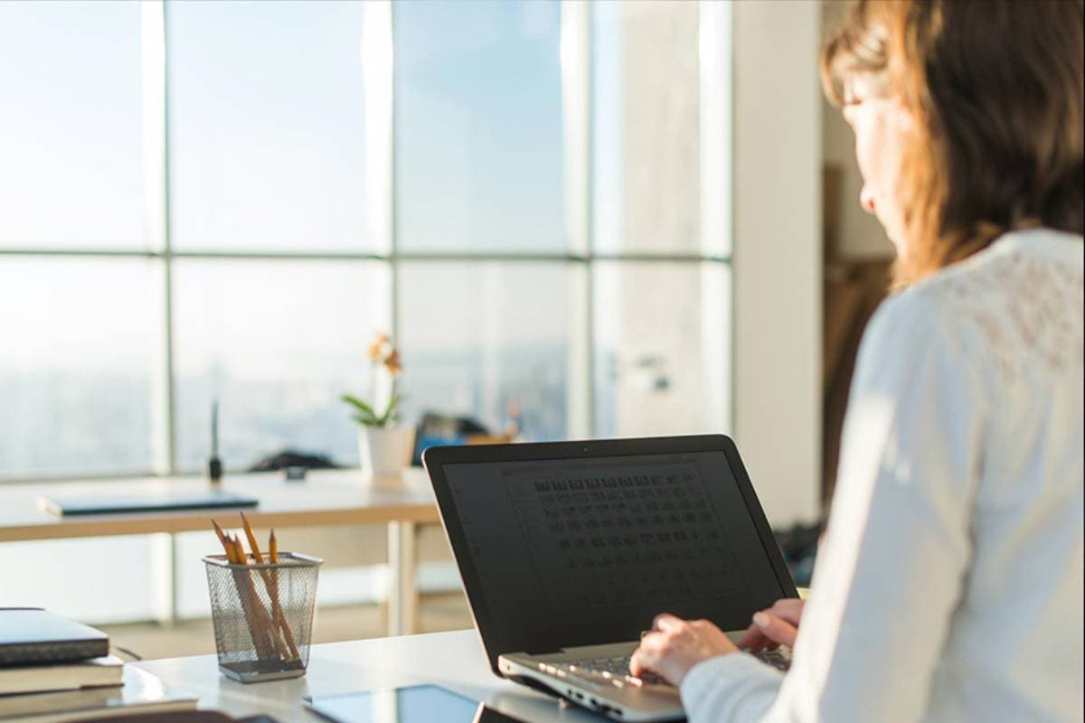 Woman in office on a computer