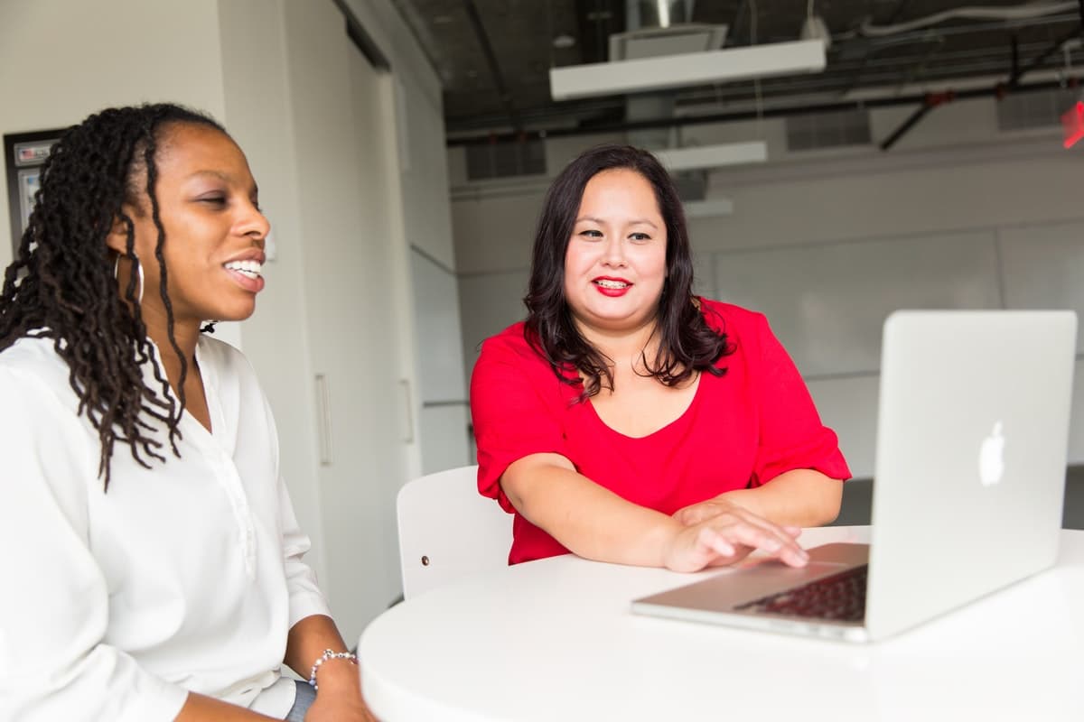 Woman helping another woman