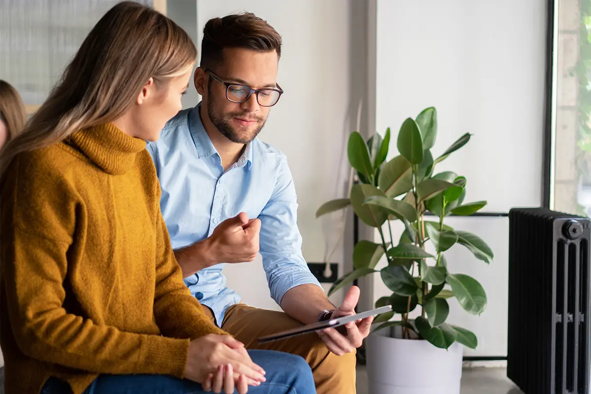 man-and-woman-looking-at-tablet
