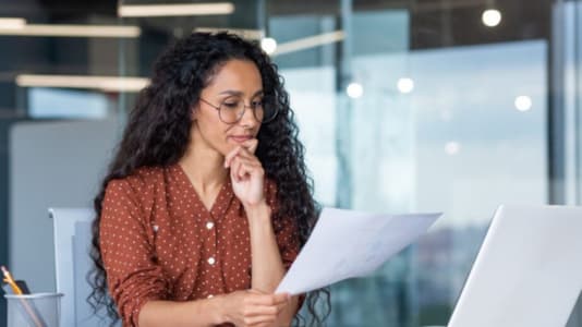 Woman reading from a paper